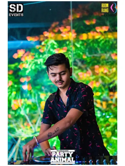 Just feeling the vibe. A candid shot of me at the console against a beautiful, lush background, mixing music in a different kind of setting.