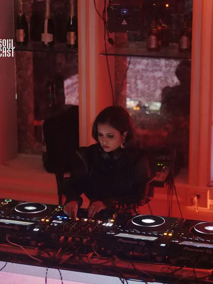 A moody shot from a "Krafted" event, one of my curated nights. The red lighting and my focused expression reflect the deep, atmospheric techno I was playing.