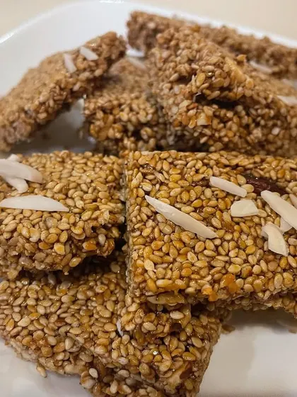 This is my homemade Gud Gajak, a nourishing winter sweet. It's made with roasted brown sesame seeds, nuts, desi ghee, and unrefined jaggery. Making it at home means I can control the amount of sweetness.