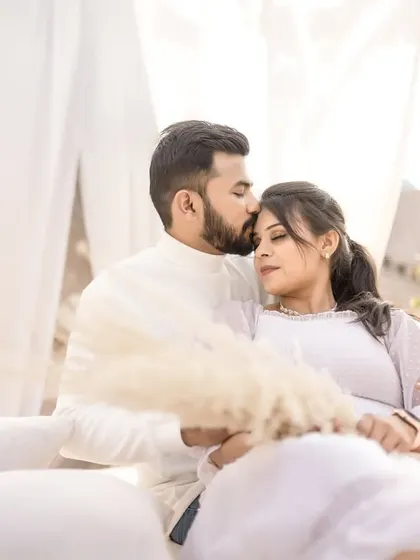A tender and intimate moment with the groom kissing his bride's forehead. These soft, quiet moments are just as powerful as the grand ones.
