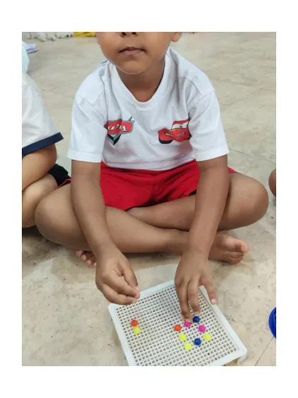 Creating patterns with colorful pegs is a fun way to introduce early math concepts and develop fine motor skills.