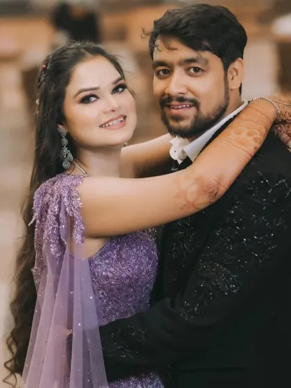 A happy, candid portrait of the couple at their ring ceremony, showcasing their genuine smiles and love.