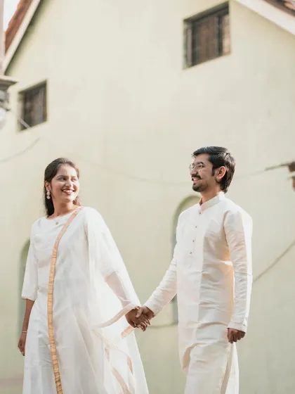 Walking hand-in-hand with happy smiles. This is a perfect example of a simple, candid, and heartwarming couple photo.