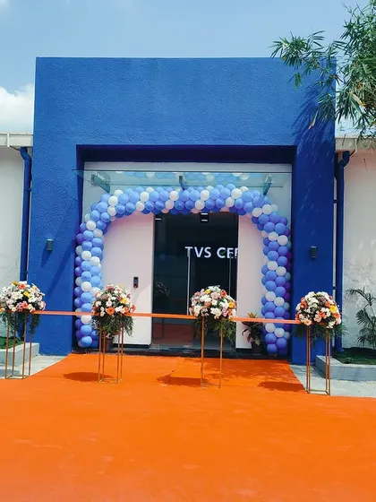 A closer view of the entrance during the inauguration. The design provides a grand sense of arrival, setting the stage for the auction experience inside.