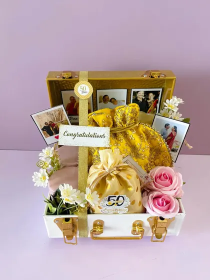 Another angle of the 50th Anniversary trunk. The gold and white color scheme adds a touch of elegance to this milestone gift.