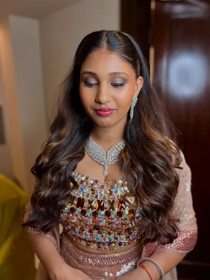 A closer view of the reception makeup, highlighting the blended shimmer eyeshadow and the radiant, dewy finish on the skin.