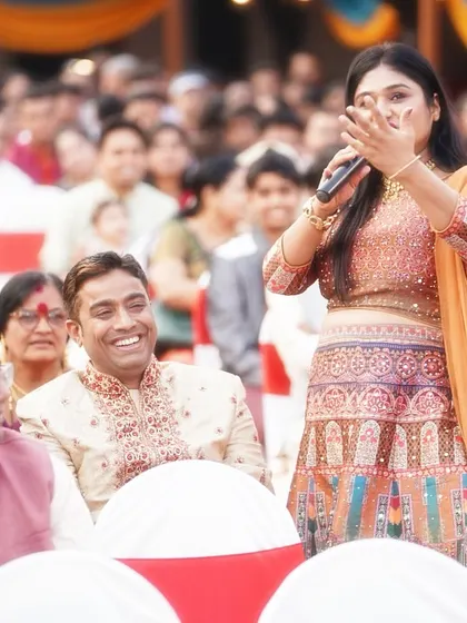 A candid moment of laughter and connection with the audience. Their energy fuels my performance.