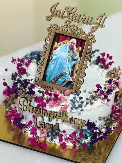 Honoring Guru Ji's birthday with a special collection of divine cakes. Each one is crafted with love and devotion, featuring elegant toppers and floral details.