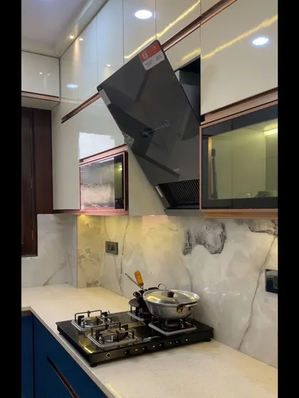 This shot highlights the integrated chimney and microwave unit, which are seamlessly built into the cabinetry for a clean and uncluttered look.