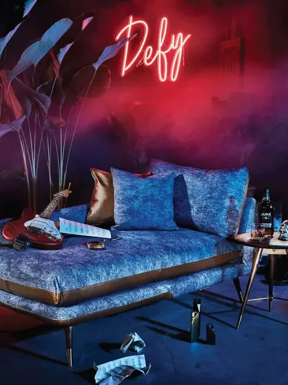 The Volta chaise lounge, styled with an electric guitar, embodies the collection's inspiration from the world of music. It’s a piece that is as much about attitude and artistry as it is about comfort.