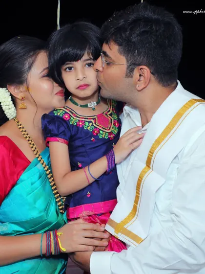 A tender family moment during a housewarming ceremony. We focus on capturing the emotional connections between family members amidst the traditional rituals.
