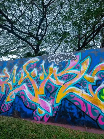 The finished Masala style piece in Jakarta. The vibrant pinks and yellows against the dark blue background make the Devnagri letters really stand out.