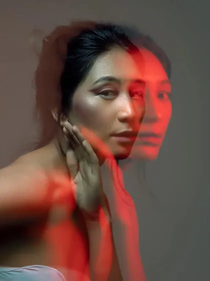 Another creative shot using movement and light to create a double-exposure effect. This highlights how the makeup holds up and remains a key feature even in artistic and unconventional photography.
