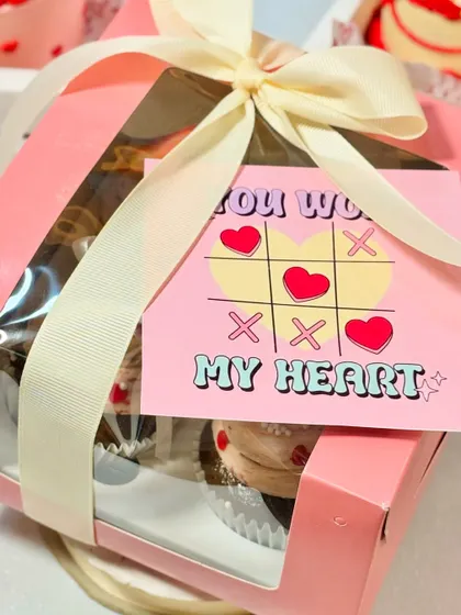 My "You Won My Heart" cupcake box is a playful and sweet Valentine's gift. The cute tic-tac-toe card adds a fun touch to the delicious, freshly baked cupcakes inside.