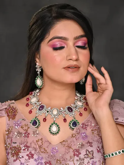 A close-up of the pink cut-crease eye makeup. The shimmer on the lid adds dimension and makes the eyes pop.