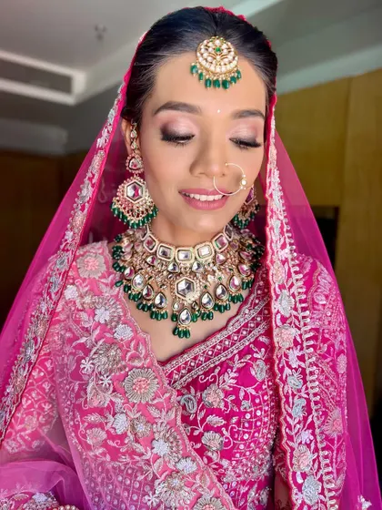 A close-up showcasing the soft pink eyeshadow and perfectly blended skin. This look is ideal for brides who want a romantic and gentle makeup style.