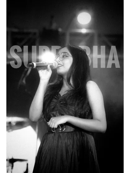 A classic black and white shot from a live show. It captures the timeless feeling of being on stage and performing.