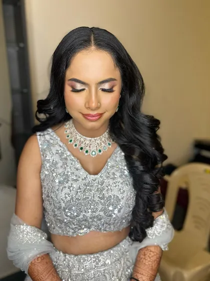 A beautiful reception look in a sparkling silver lehenga. I created a soft, glamorous eye and paired it with voluminous curls for a look of pure elegance.