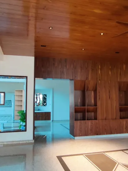 A different angle of the living area with extensive wood paneling.