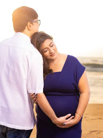 A quiet moment of connection, resting on his shoulder. We guide you into poses that feel natural and highlight the supportive bond between you as a couple.