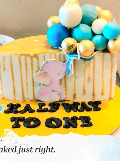 A "halfway to one" cake for a six-month celebration. This half-cake design is a fun and unique way to celebrate this special milestone.