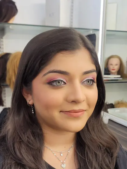 This front-facing shot shows how the pink semi cut crease opens up the eyes. The soft blush and neutral lip balance the look perfectly.