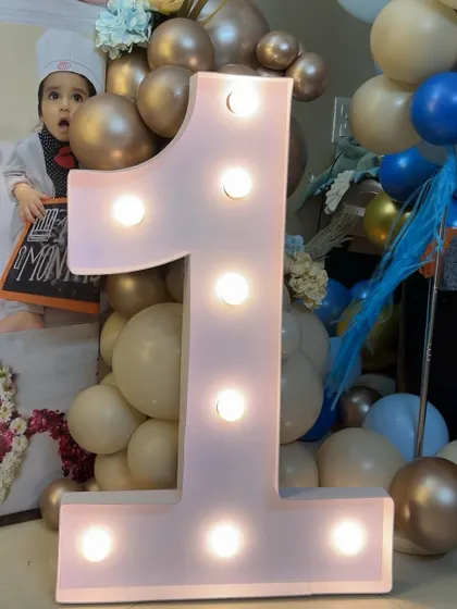Our light-up marquee numbers are a popular addition to first birthday parties, creating a perfect photo opportunity.