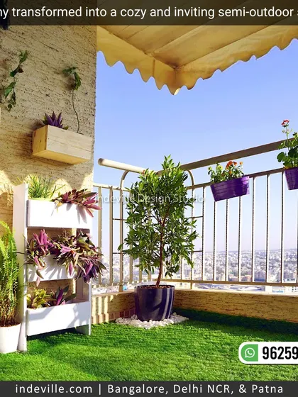 A balcony transformed into a cozy, green paradise. I used handcrafted wooden planters, including hanging boxes and a multi-tiered stand, along with railing planters and artificial turf to create this inviting semi-outdoor space.