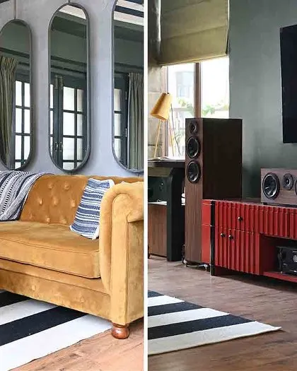 A split view of the media room, showing the comfortable tufted sofa and the red fluted media console for the home theater system.