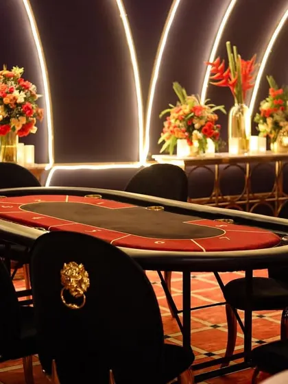 A close-up of one of the poker tables, ready for the night's games. The chairs with lion-head knockers added a touch of regal flair to the setup.