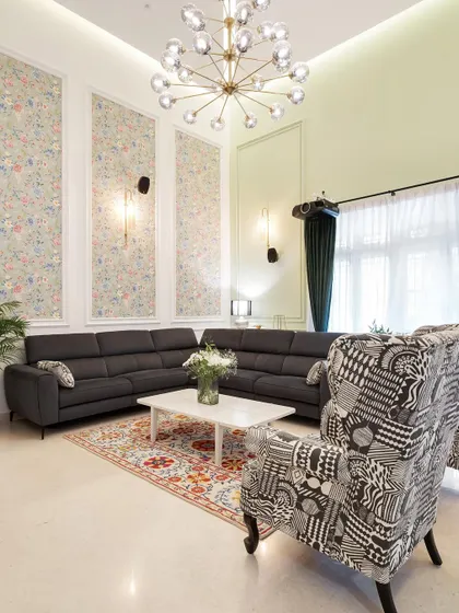 The goal for this living room was a cozy, pleasant ambiance. We customized these armchairs with a bold fabric from Freedom Tree to contrast with the simple, comfortable sofa, creating a look that is coordinated but not matching.