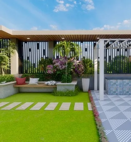 The other side of the Jaipur terrace, featuring a lawn, a jacuzzi, and a built-in planter with bench seating.