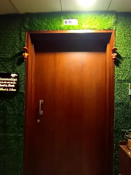 A straight-on shot of the doorway framed by artificial grass. This simple addition completely changes the character of the entrance, making it feel more personal and connected to nature.