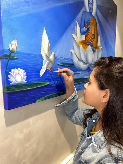 This is me adding the final touches to one of my personal pieces, a serene Buddha painting. I believe that to be a good guide, I must also be a passionate artist myself. This artwork is a reflection of the peace and focus I find in painting, a feeling I hope to share with all my students.