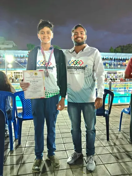 Congratulations to Shaswat Singh for securing a bronze medal in the 50m Backstroke at the NRJ State Swimming Championships. This picture captures the proud moment with his coach by the poolside.