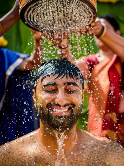 A groom enjoying the fun of the Haldi ceremony. This vibrant ritual, full of color and laughter, is one of our favorite events to photograph.