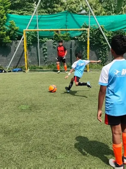 A young player takes a penalty kick during our competition day. It's a great experience for them to handle pressure in a supportive setting.