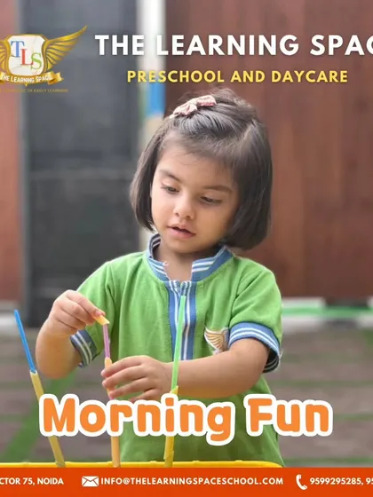 A focused young learner during morning fun. The concentration required for these activities helps improve attention span and cognitive skills.