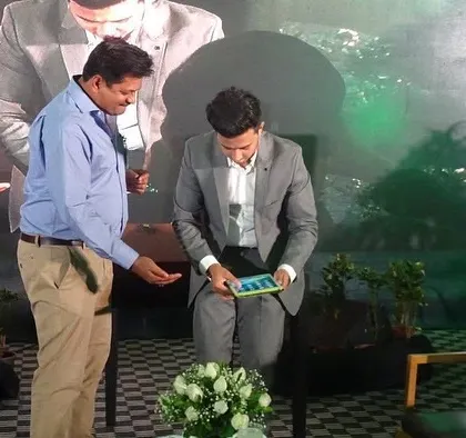 Audience participation is key to a successful corporate show. In this photo, I've invited a guest on stage to be part of an iPad illusion, making the magic interactive and creating a fun, engaging moment for everyone watching.