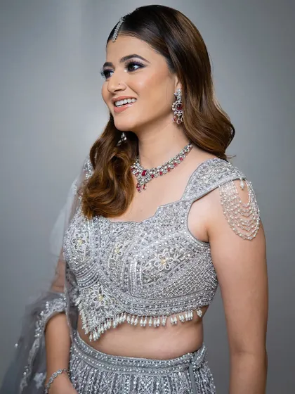 Another happy shot of the model in the silver-grey lehenga, showcasing the intricate beadwork.