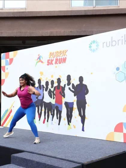 An action shot from the Rubrix 5K Run. I give every event my all, ensuring everyone is warmed up and smiling.