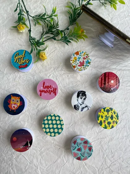 More designs for my mobile pop sockets, including quotes, patterns, and illustrations.