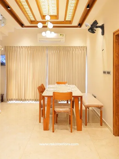 A unique feature in the Calicut home: a personal home elevator seamlessly integrated next to the staircase and dining area.