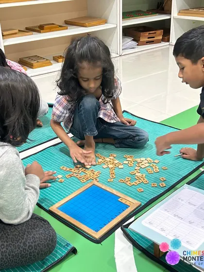 Children collaborate on a language activity, working together to solve a puzzle and build their vocabulary.
