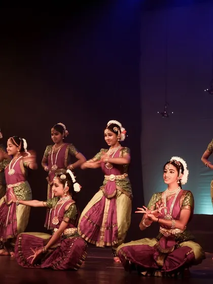 A dynamic group performance, showing the energy and rhythm of Bharatanatyam.