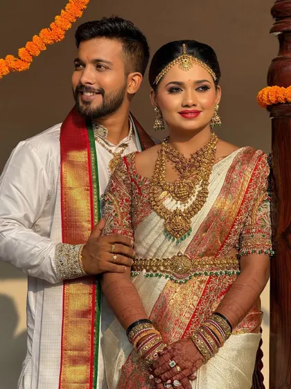 The beautiful bride Nidhi and her groom. I had the pleasure of draping her stunning white and red silk saree for her wedding day.