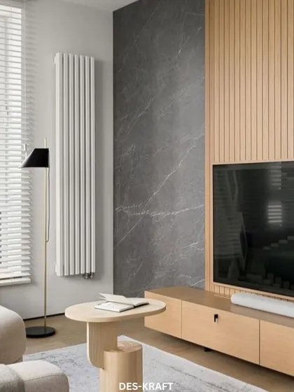 The TV wall is a study in texture, combining dark grey marble with light wood fluted panels for a visually interesting and modern entertainment center.
