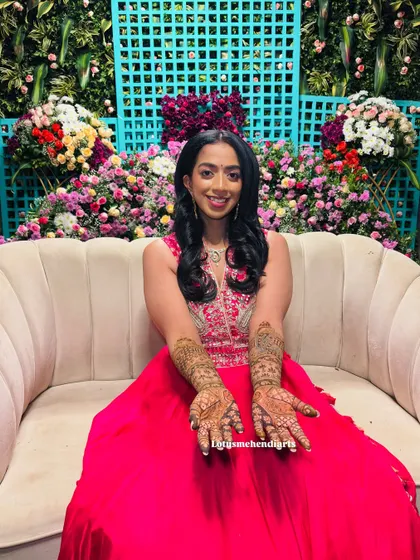 The full view of the bride's peacock and lotus mehendi. The joy on her face is the best reward for my work.