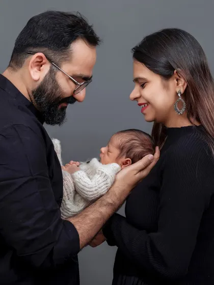 Those first few days are so precious and fleeting. I specialize in newborn photography that focuses on the tender connection between you and your baby. This studio portrait captures the quiet, overwhelming love of becoming new parents.