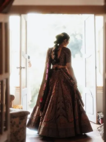 A timeless bridal portrait. We ensure our decor provides the most beautiful backdrops for your wedding photos, like this shot of the bride against a brightly lit doorway.